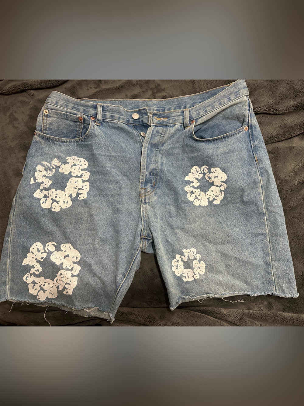 DENIM TEARS - Light Blue Distressed Denim Shorts with White Graphic Details